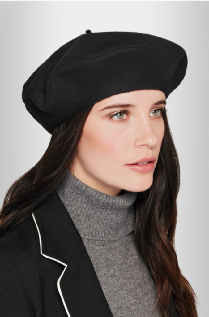 Cap it off with a beret! Cher wears a black beret teamed with a white Oxford shirt and black and white striped sweater. Buy HERE.